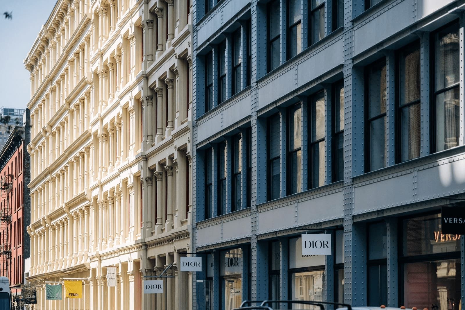 Cast-iron facades of historic buildings on a sunlit street in New York