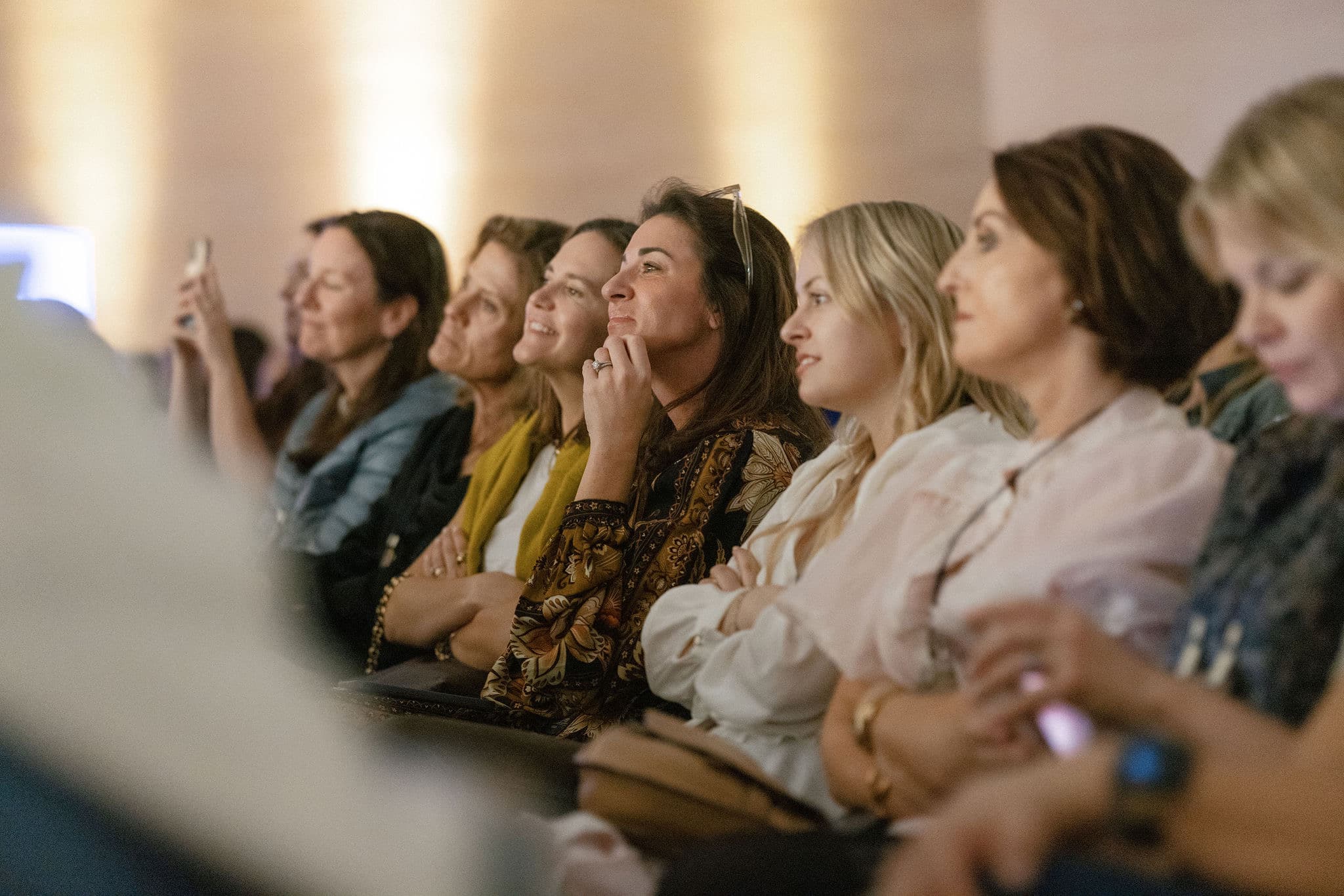 Advisors listening to a speaker at a TakeOff session