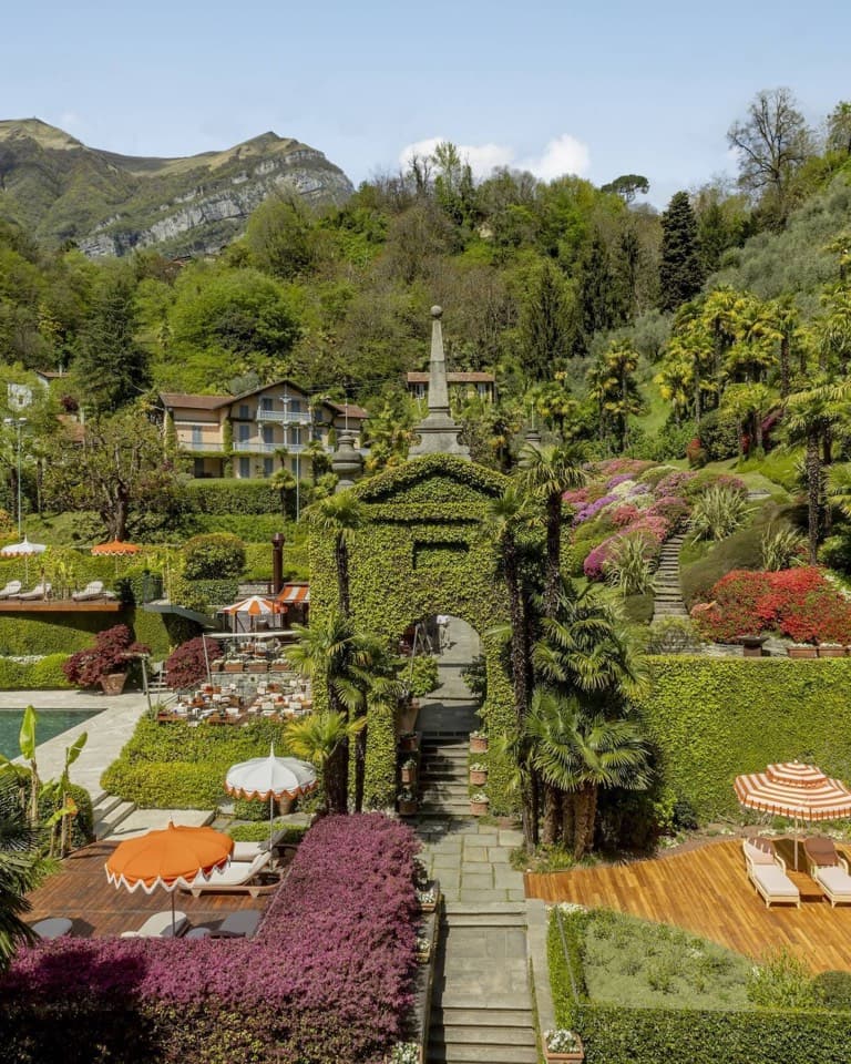 Terraced gardens and green hills above a lake